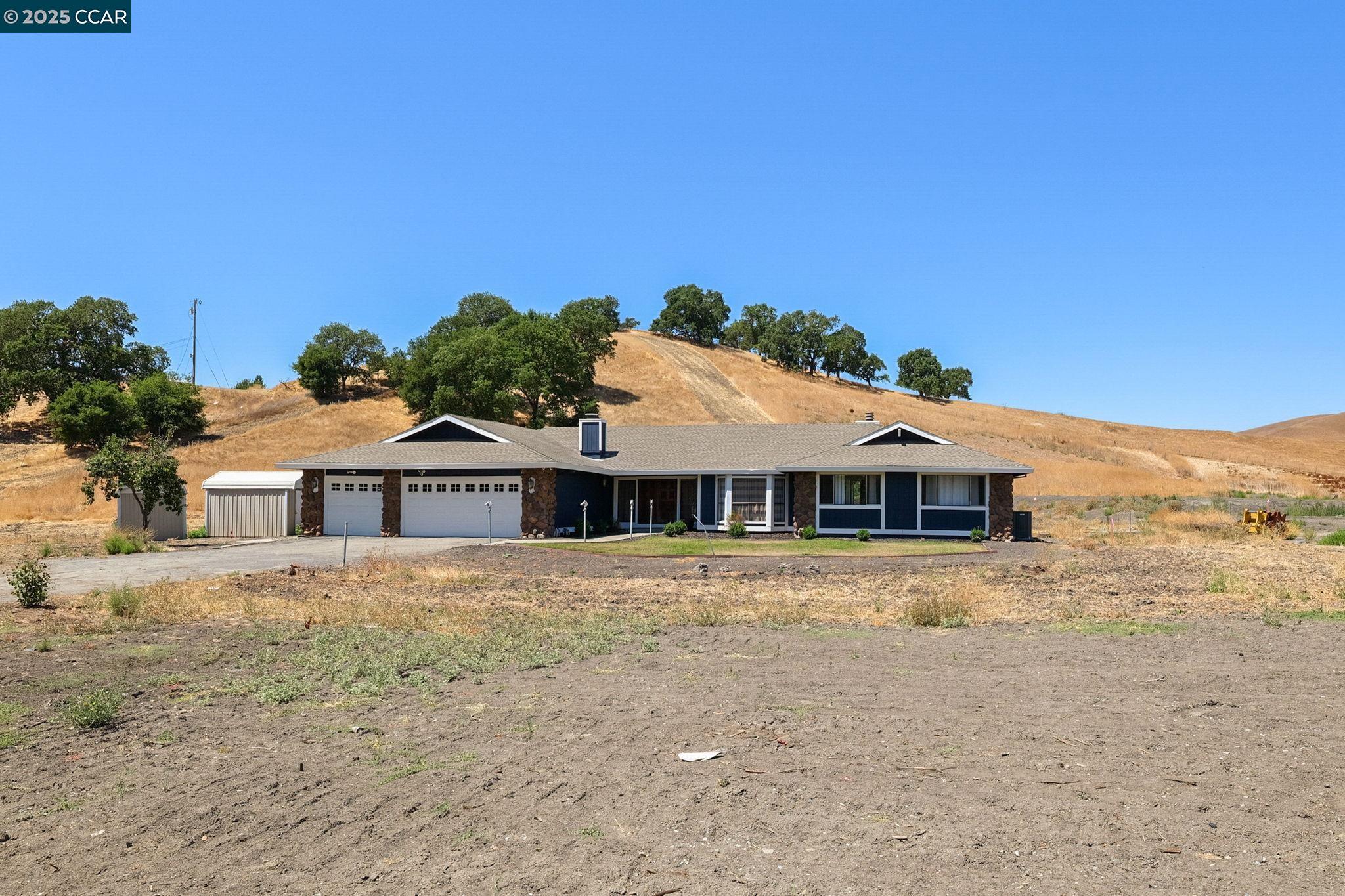 1610 Lawrence Road Danville, CA 94506 - Photo 3 of 36 a front view of a house with a yard