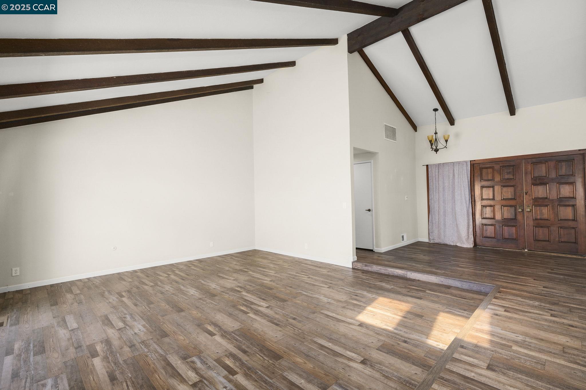 1610 Lawrence Road Danville, CA 94506 - Photo 8 of 36 a view of an empty room with wooden floor and stairs