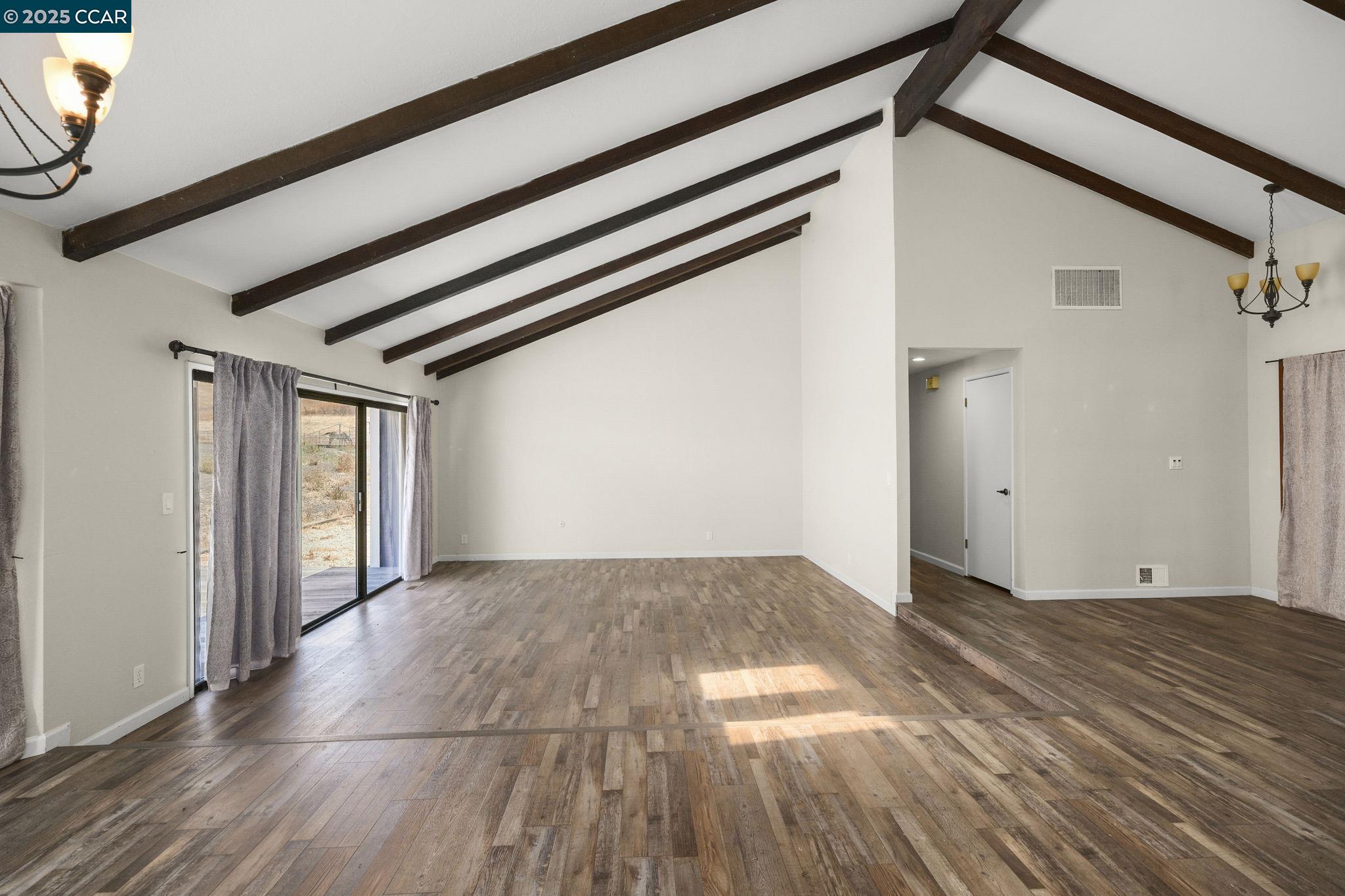 1610 Lawrence Road Danville, CA 94506 - Photo 10 of 36 a view of a big room with wooden floor and windows