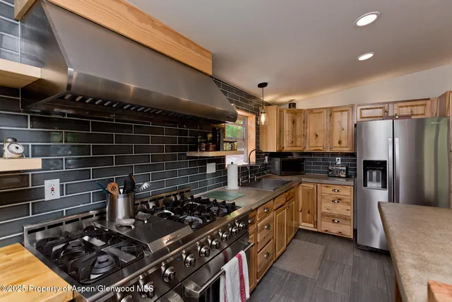 a bedroom with a bed and a wooden floor