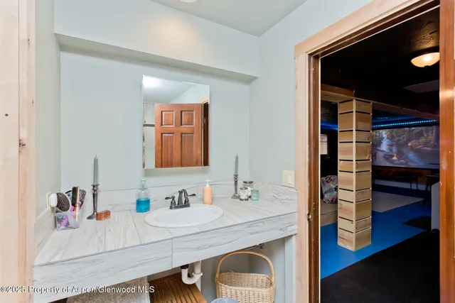 a bedroom with a bed and a potted plant