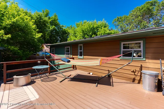 a view of a patio with two chairs and a table