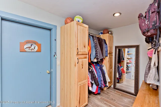a backyard of a house with small garden and plants