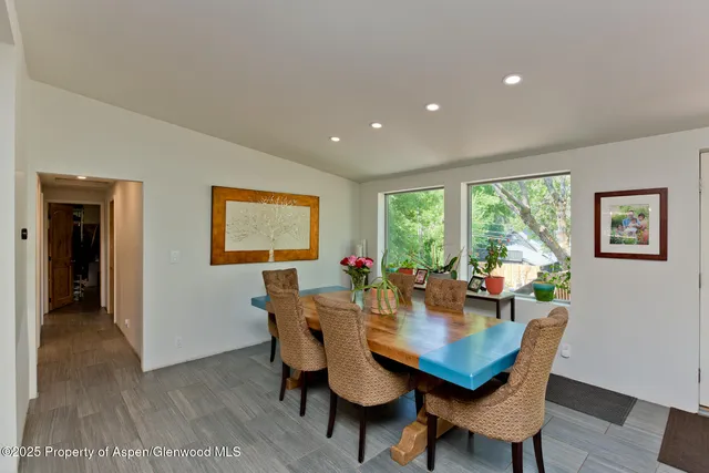 a view of a dining room with furniture window and outside view