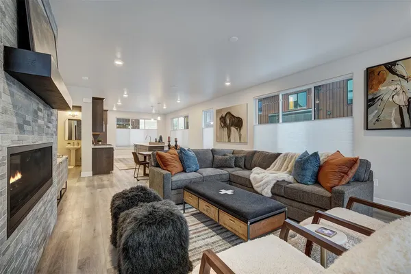 a living room with furniture fireplace and flat screen tv