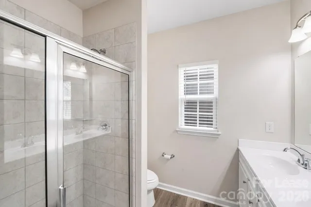 a bathroom with a bathtub and shower