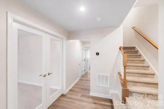a view of an entryway with wooden floor