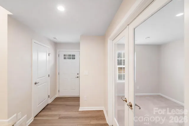 an empty room with wooden floor