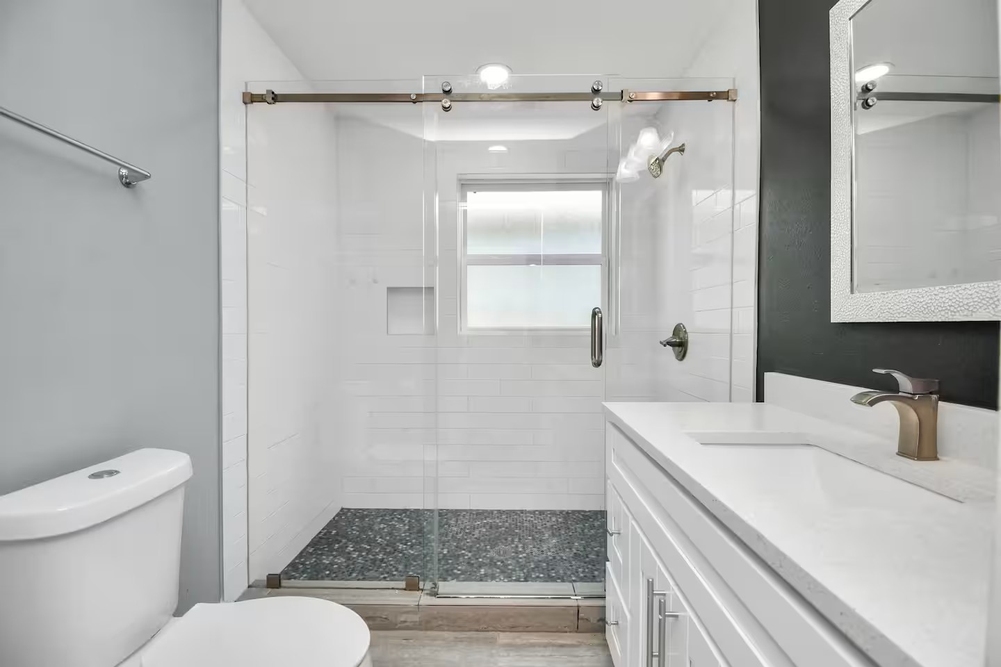 3318 Wichita Street Houston, TX 77004 - Photo 14 of 36 a bathroom with a sink a toilet and shower