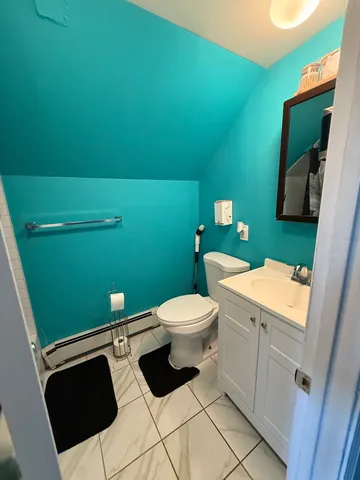 a bathroom with a toilet and a sink