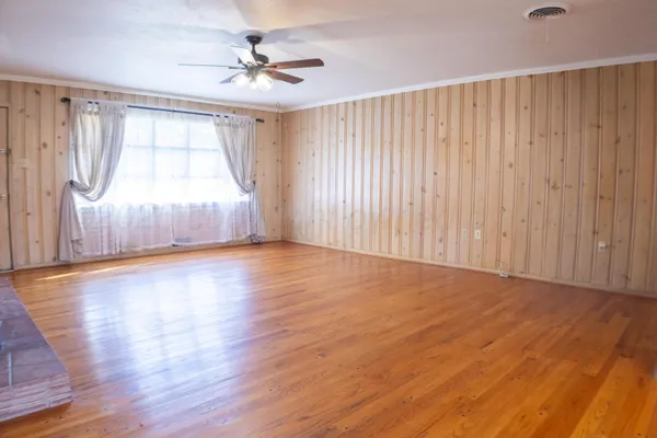 a view of kitchen with furniture and wooden floor