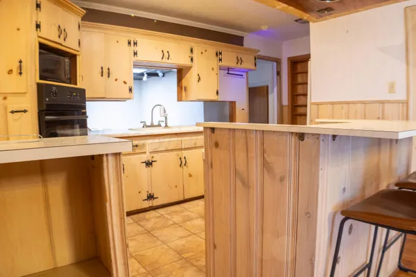 a kitchen with appliances cabinets and a sink