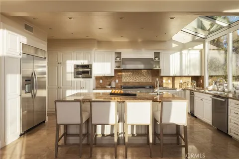 a spacious bathroom with a double vanity sink and a mirror