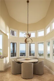 a bath tub sitting in a bathroom next to a window