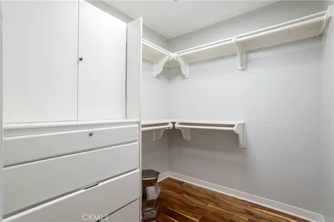 a front view of a house with yard and tree s