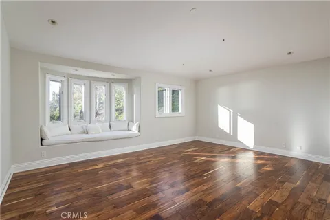 an aerial view of residential building and trees around