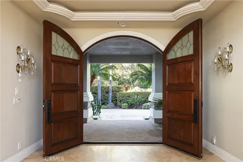 a kitchen with stainless steel appliances granite countertop a table and chairs in it