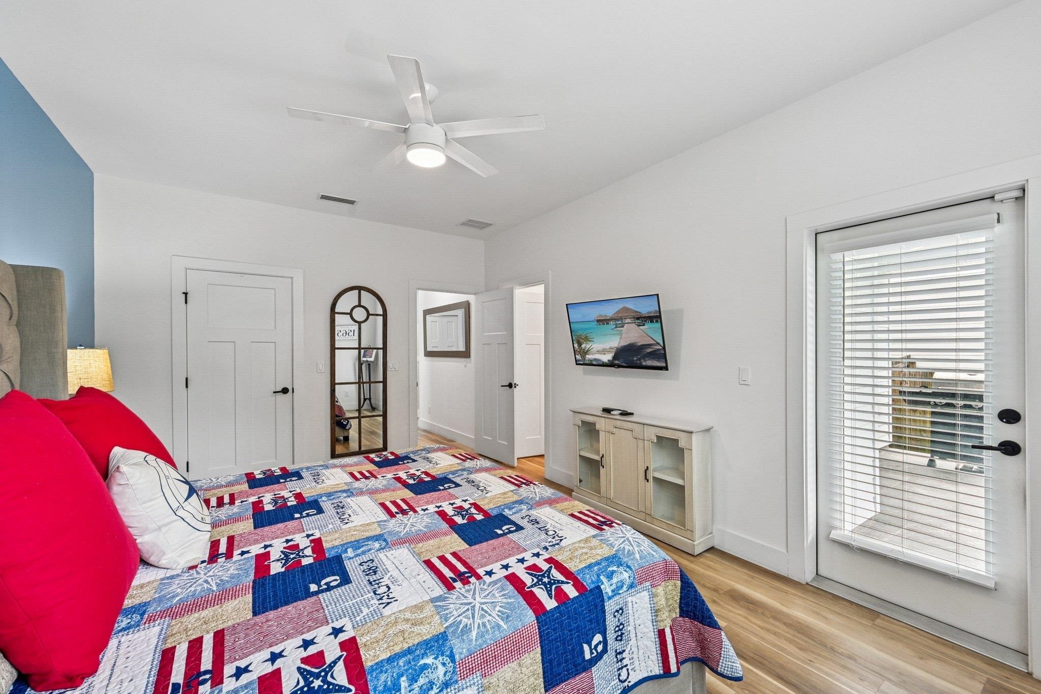 43 Menendez Road St. Augustine, FL 32080 - Photo 18 of 48 Bedroom with light wood-style floors, access to exterior, and a ceiling fan