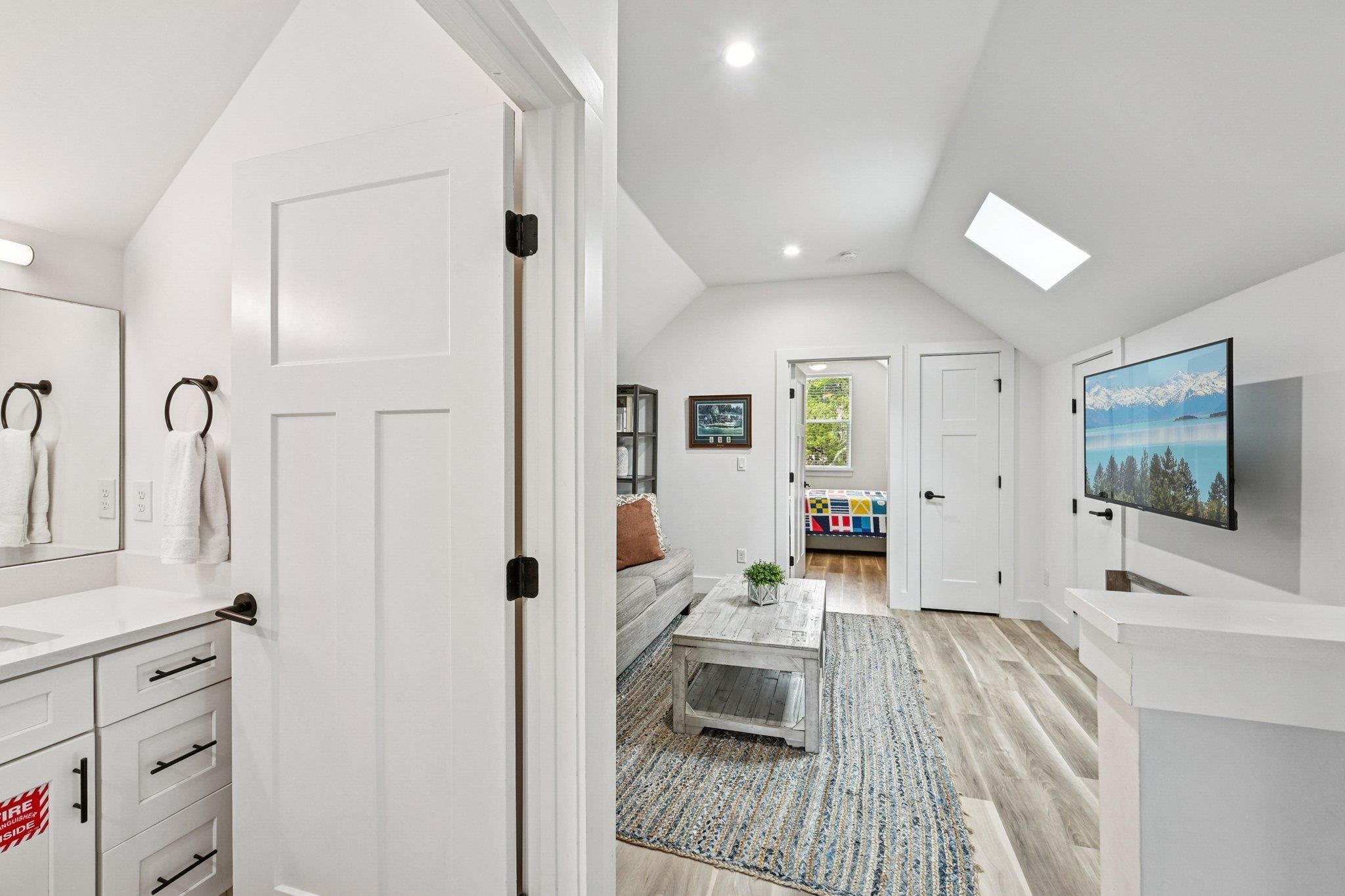 43 Menendez Road St. Augustine, FL 32080 - Photo 25 of 48 Interior space with lofted ceiling, a skylight, light wood-style floors, and recessed lighting