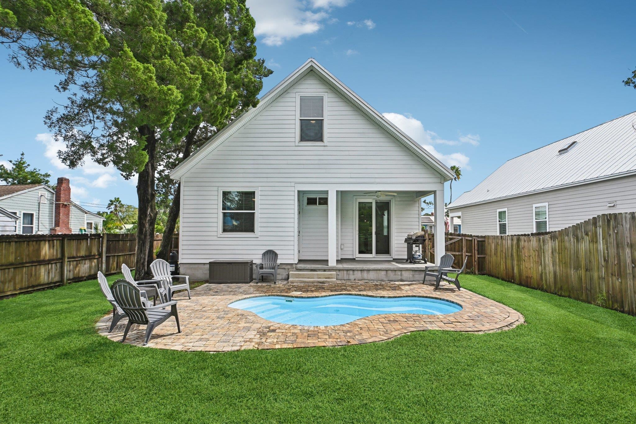 43 Menendez Road St. Augustine, FL 32080 - Photo 36 of 48 Back of property featuring a patio and a fenced backyard