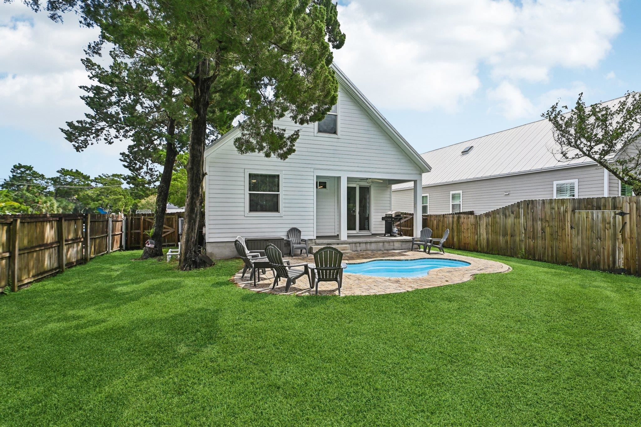 43 Menendez Road St. Augustine, FL 32080 - Photo 37 of 48 Rear view of property featuring a patio and a fenced backyard