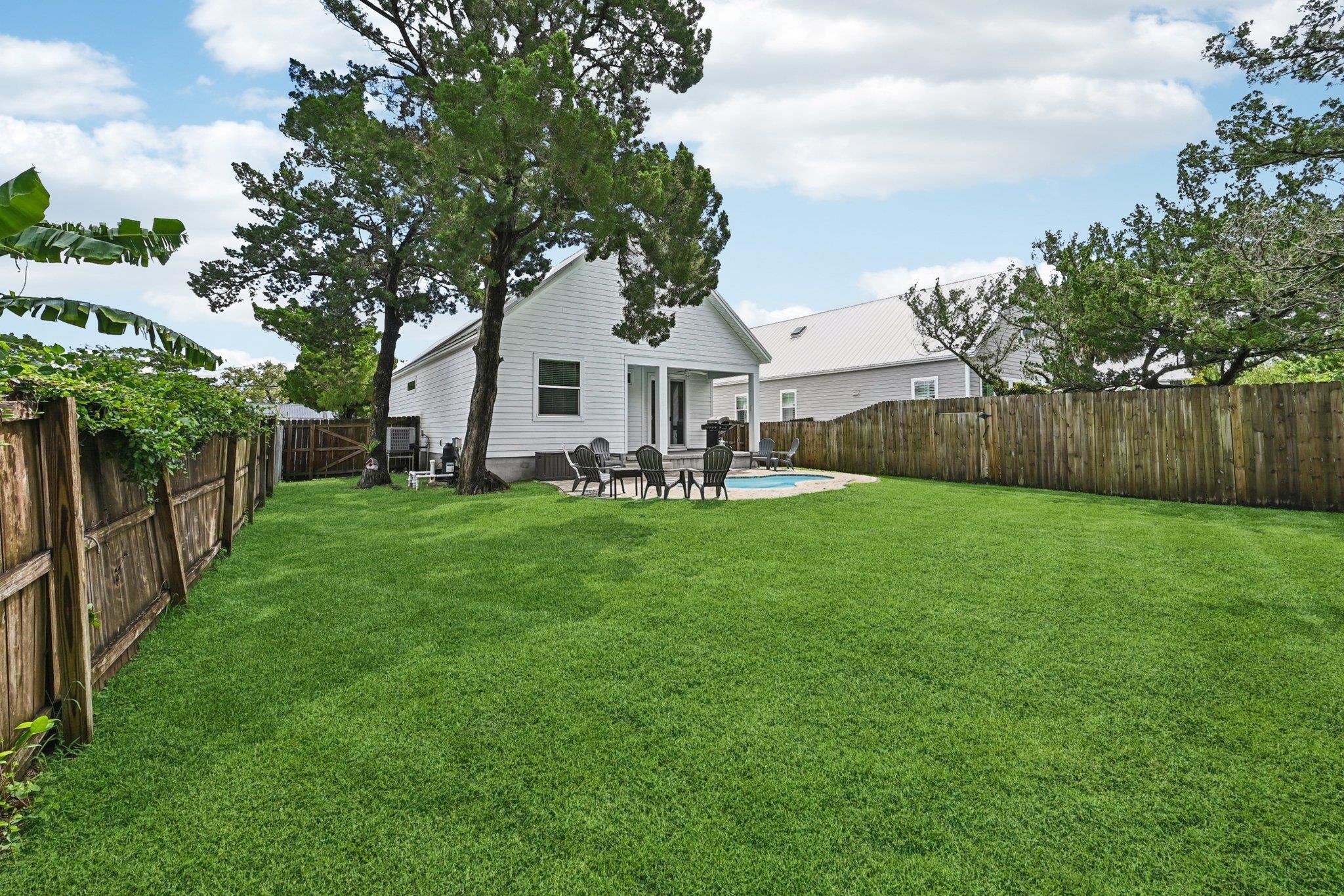 43 Menendez Road St. Augustine, FL 32080 - Photo 38 of 48 Back of property with a patio area and a fenced backyard