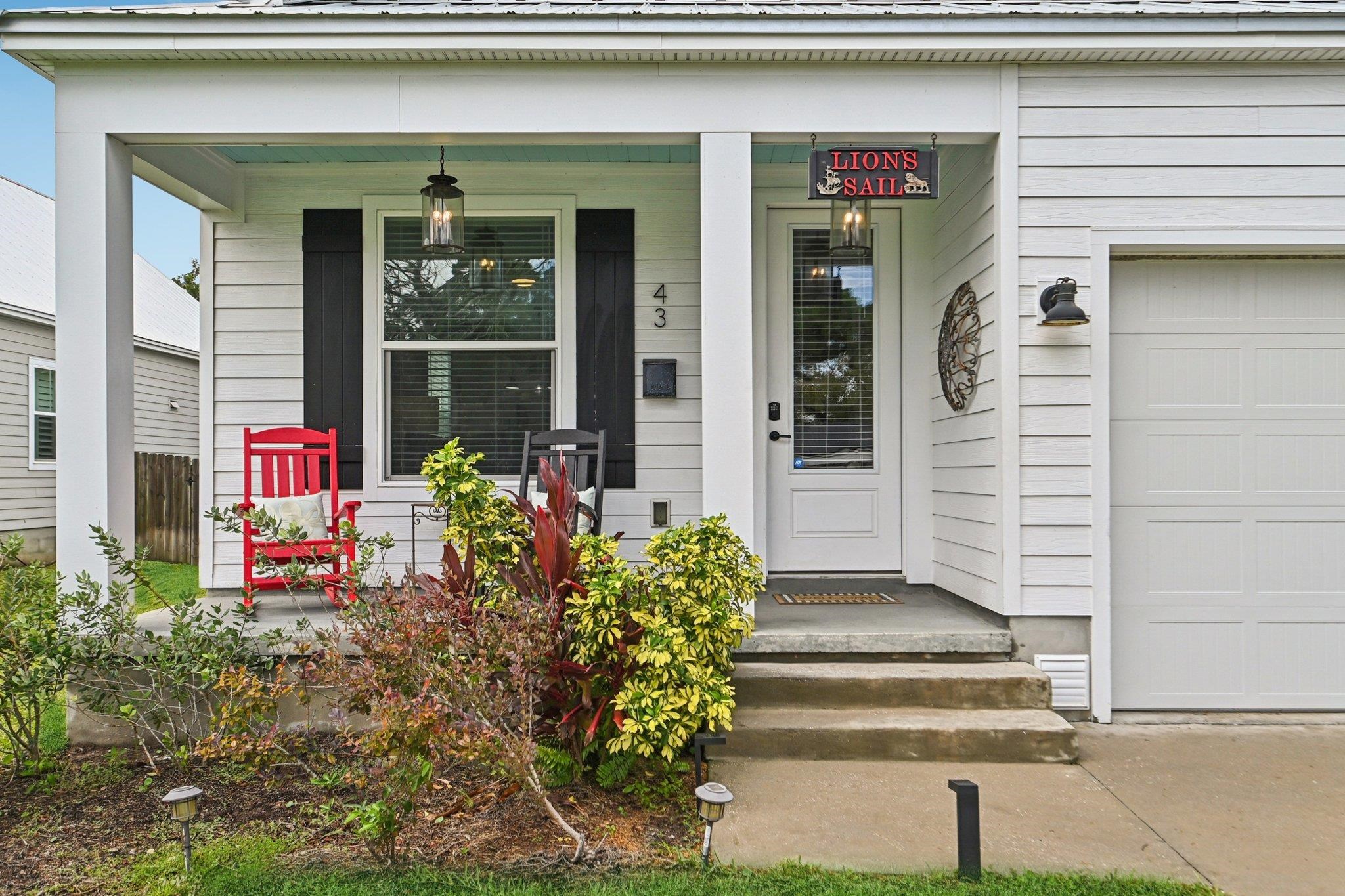 43 Menendez Road St. Augustine, FL 32080 - Photo 4 of 48 View of exterior entry featuring a porch and a garage