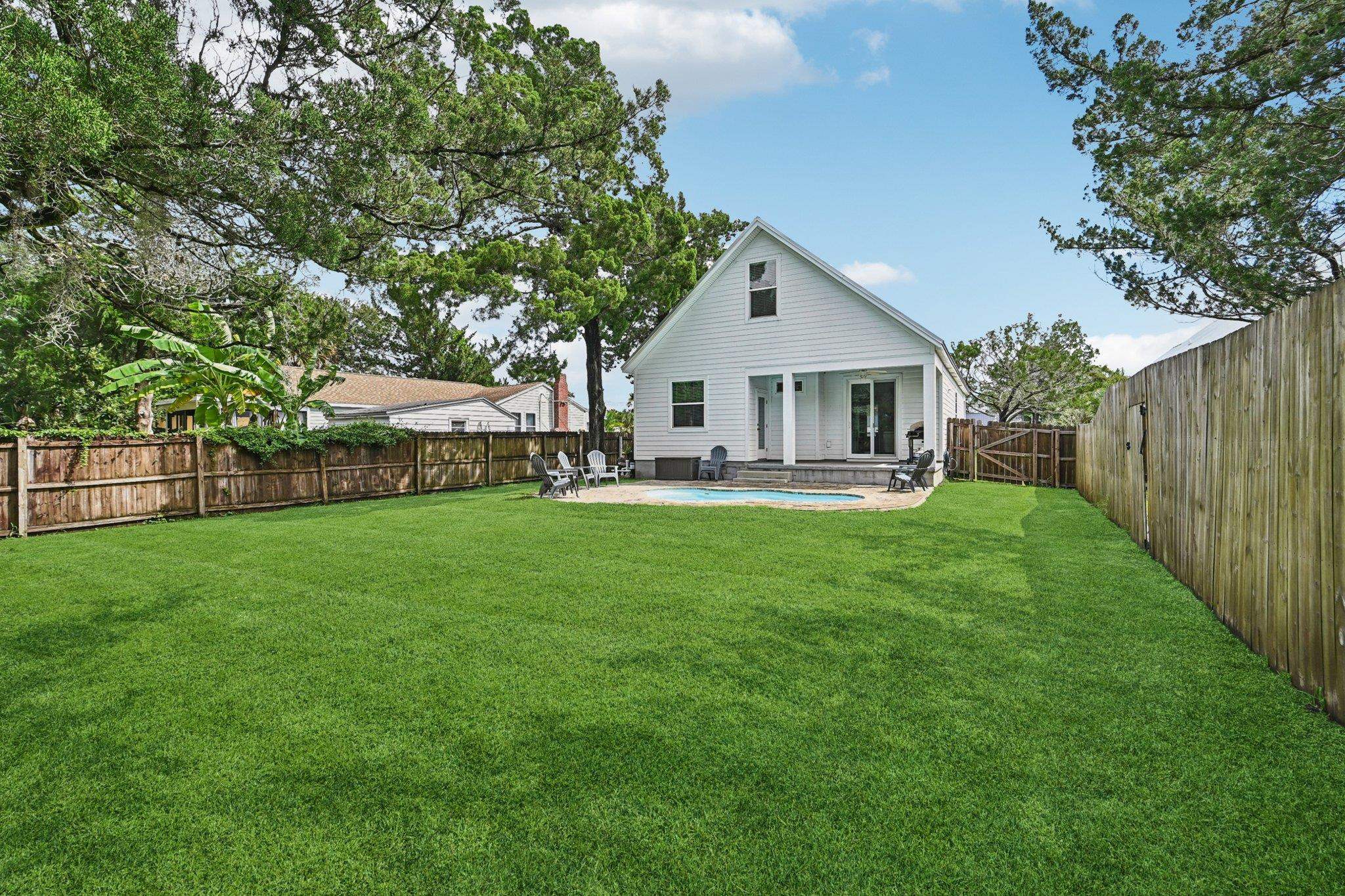 43 Menendez Road St. Augustine, FL 32080 - Photo 39 of 48 Rear view of property with a patio area and a fenced backyard