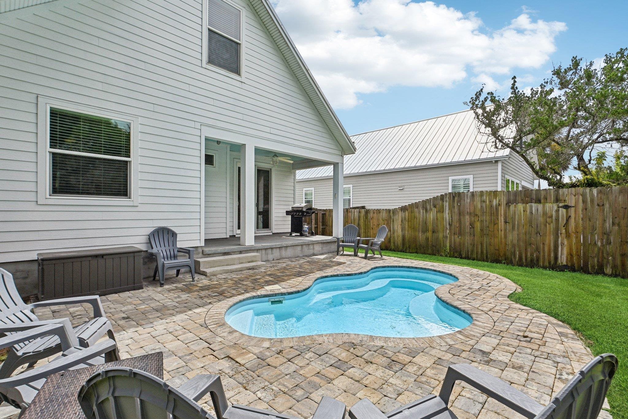 43 Menendez Road St. Augustine, FL 32080 - Photo 42 of 48 View of swimming pool featuring a patio, a grill, and an outdoor fire pit