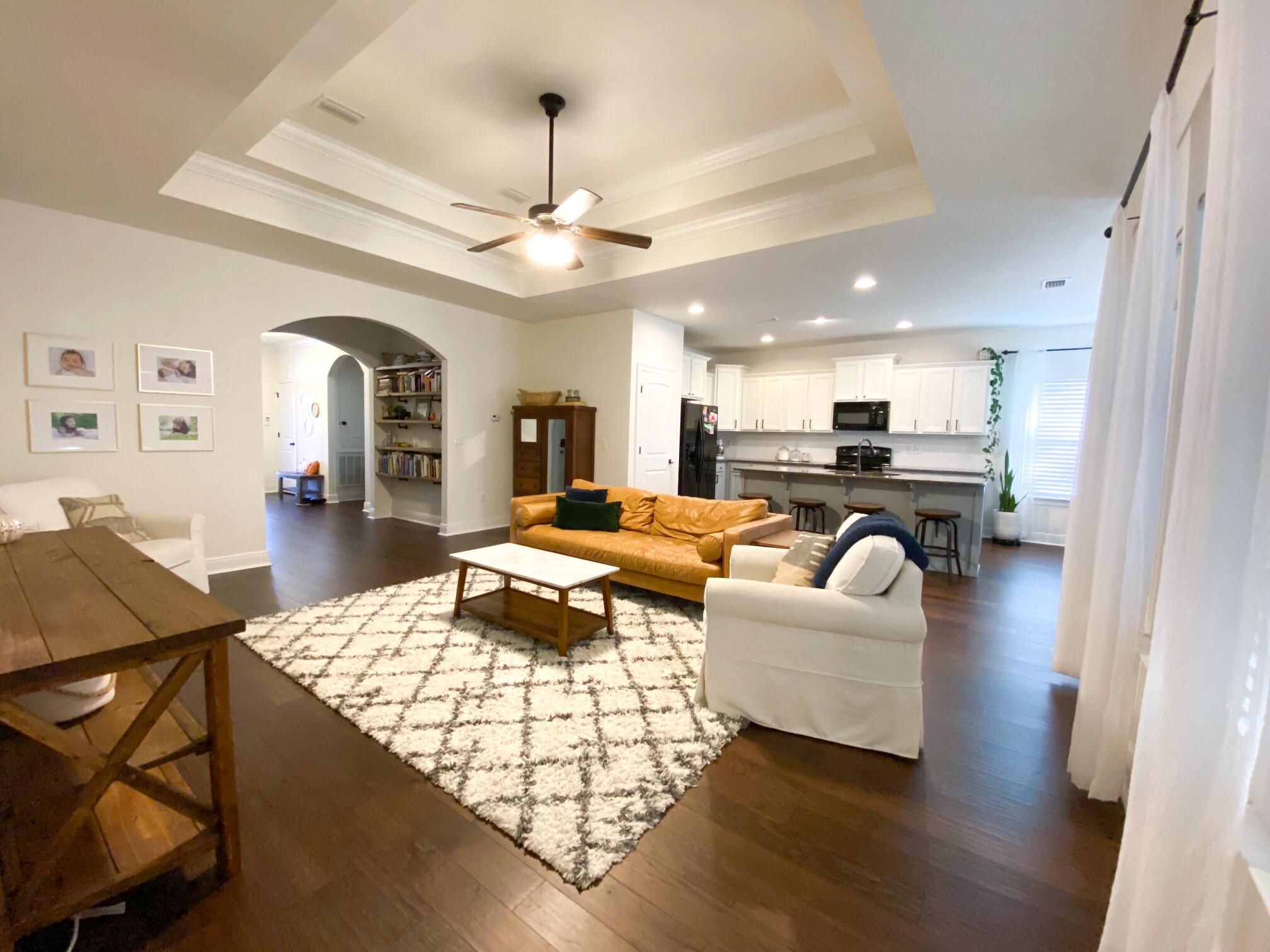 285 Maddox Street Santa Rosa Beach, FL 32459 - Photo 23 of 35 a living room with furniture kitchen view and a chandelier