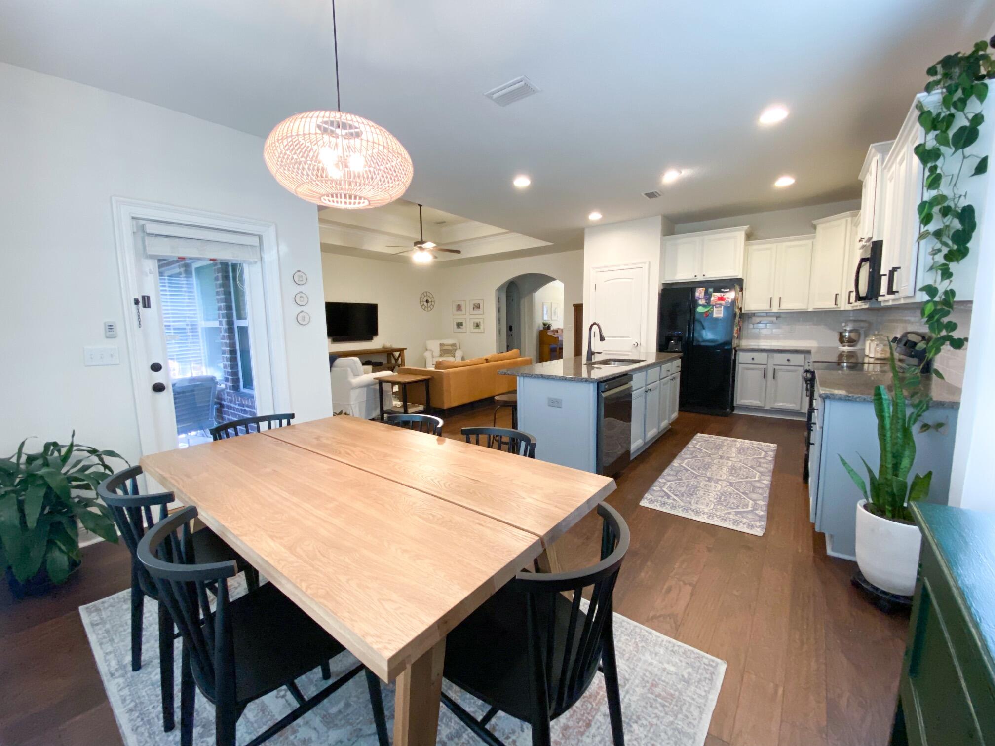 285 Maddox Street Santa Rosa Beach, FL 32459 - Photo 24 of 35 a large kitchen with a table and chairs in it