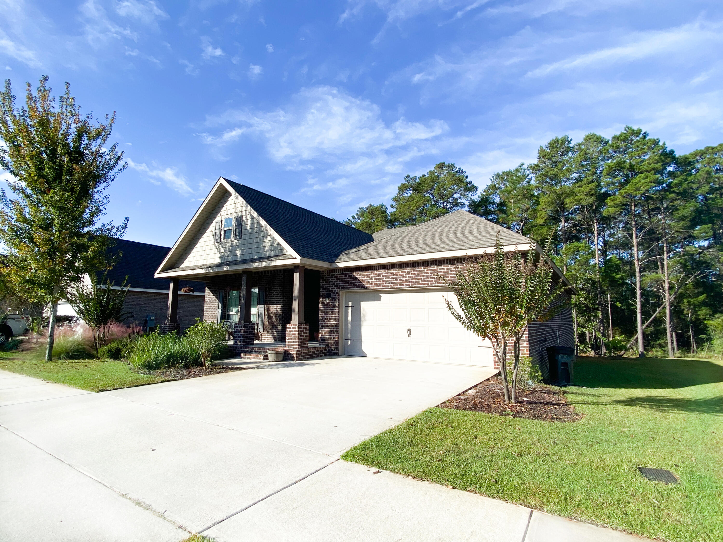 285 Maddox Street Santa Rosa Beach, FL 32459 - Photo 3 of 35 a front view of a house with a yard
