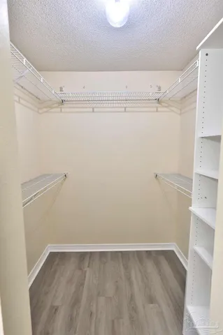 a view of an empty walk in closet