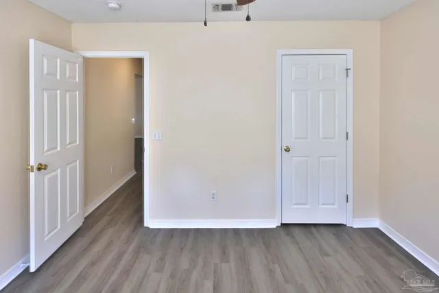 a bathroom with a sink a toilet a mirror and shower