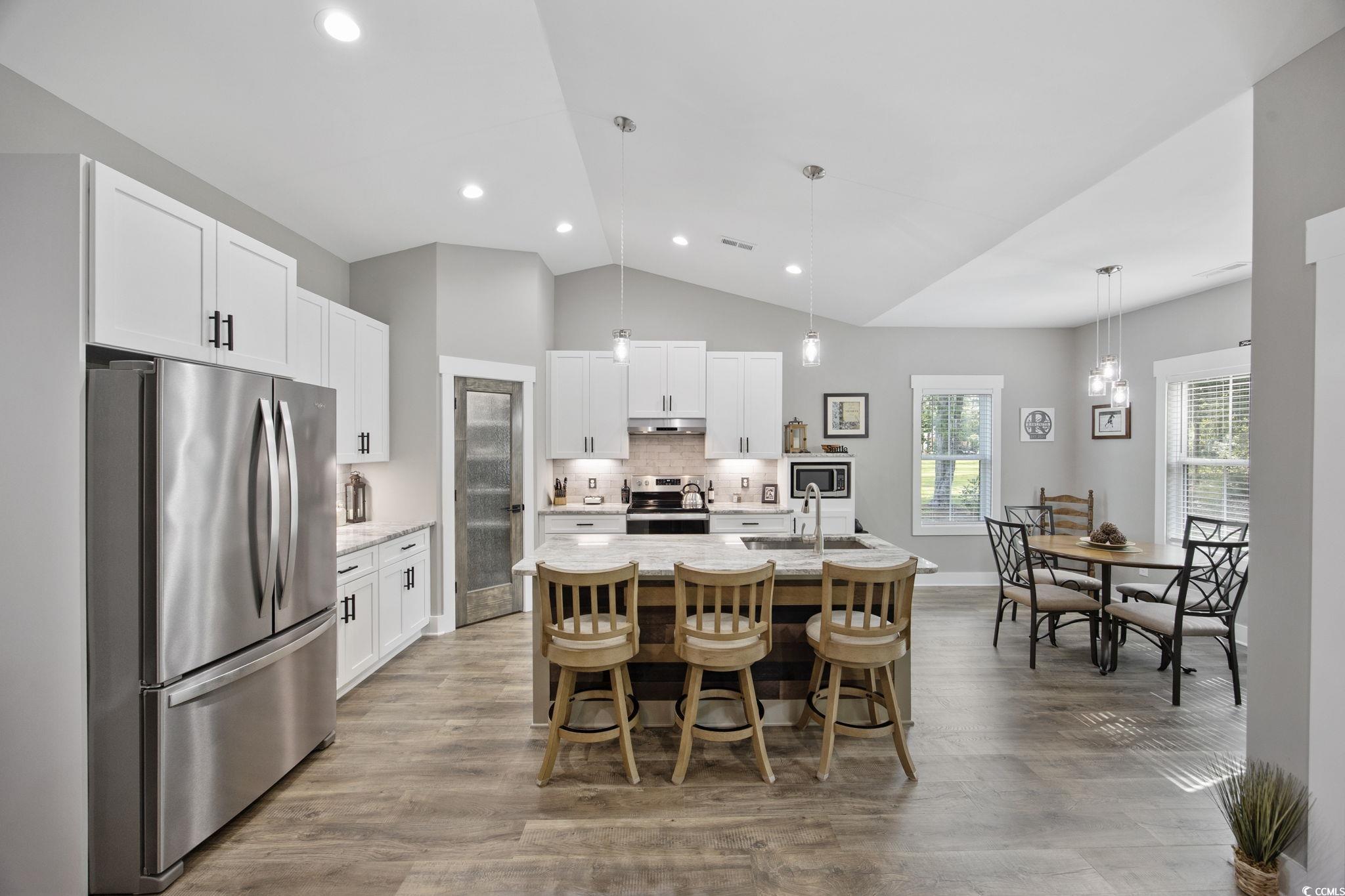 4446 Boggy Road Conway, SC 29526 - Photo 11 of 25 Dining room featuring vaulted ceiling, wood finished floors, and recessed lighting