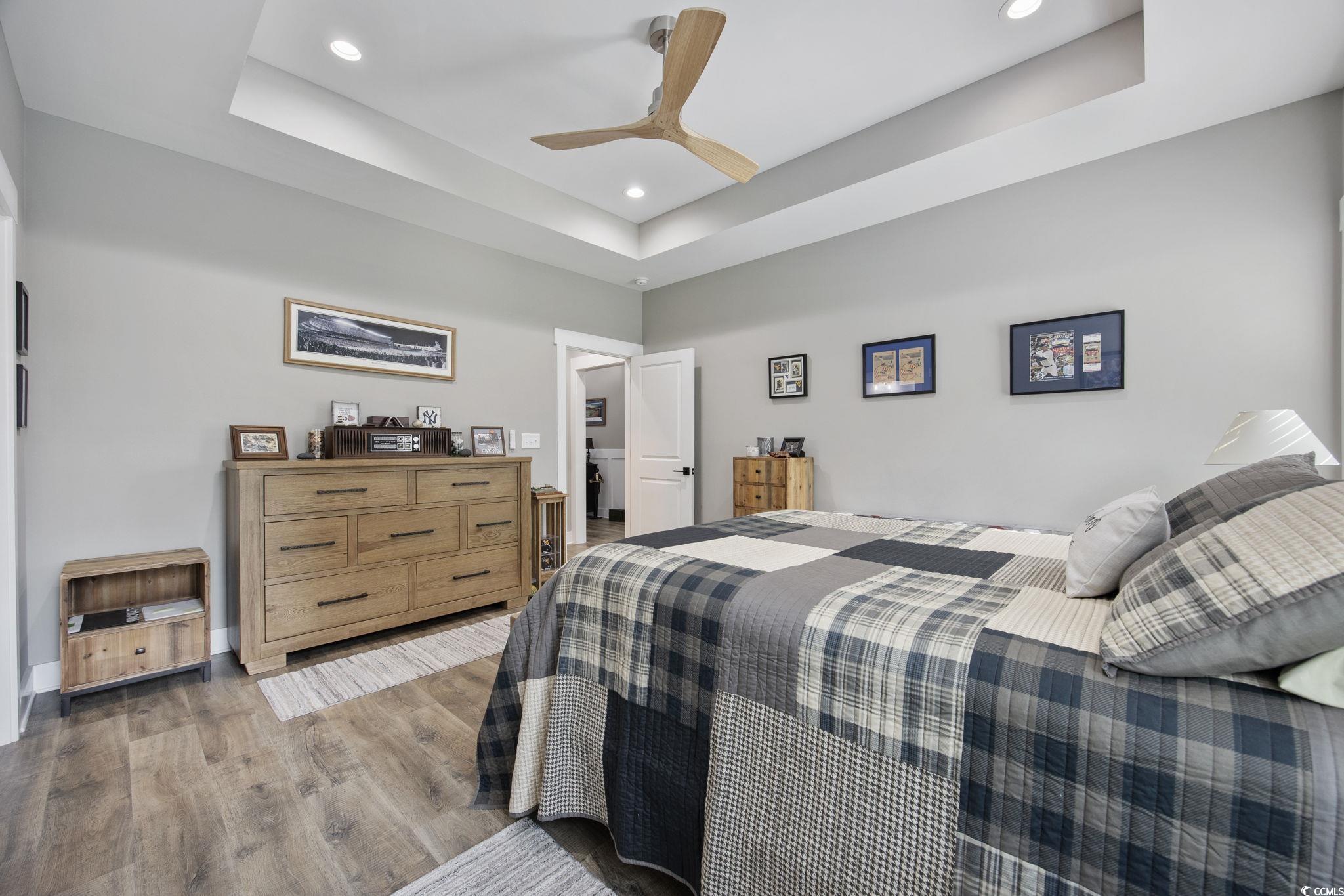 4446 Boggy Road Conway, SC 29526 - Photo 14 of 25 Bedroom with a raised ceiling, recessed lighting, light wood-style flooring, and ceiling fan