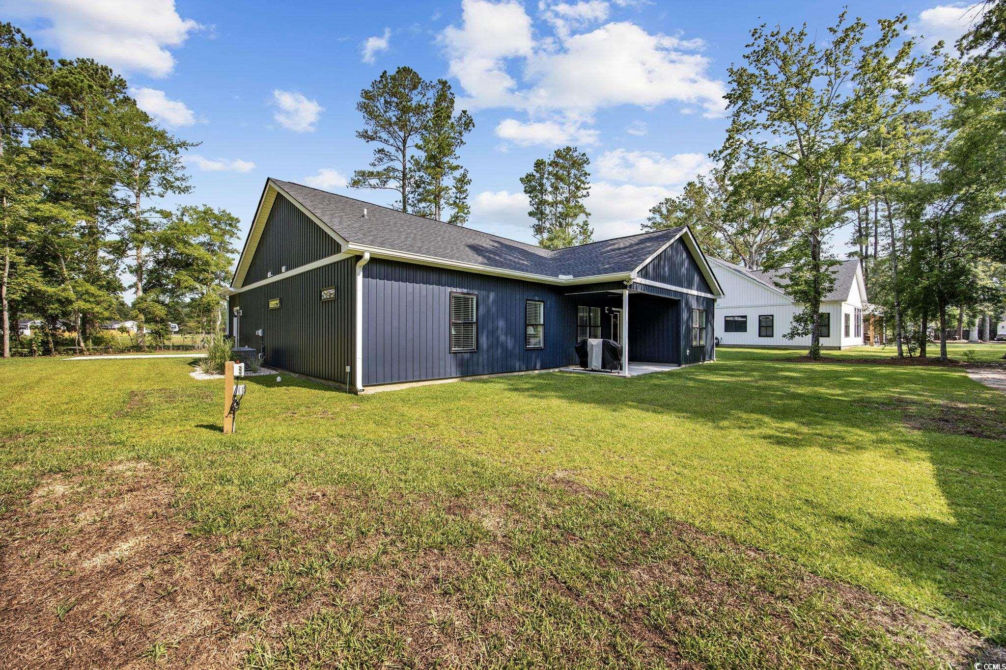 4446 Boggy Road Conway, SC 29526 - Photo 20 of 25 Back of property featuring a yard and roof with shingles