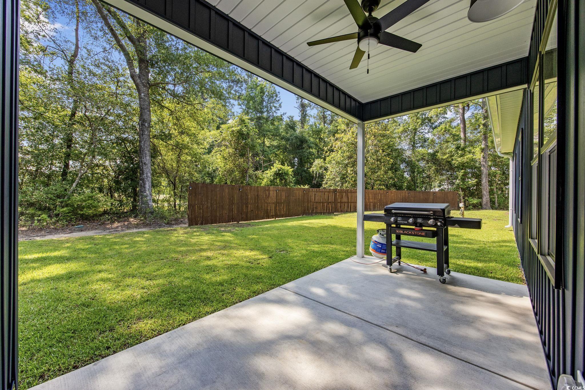 4446 Boggy Road Conway, SC 29526 - Photo 21 of 25 View of patio / terrace with ceiling fan, grilling area, and view of wooded area