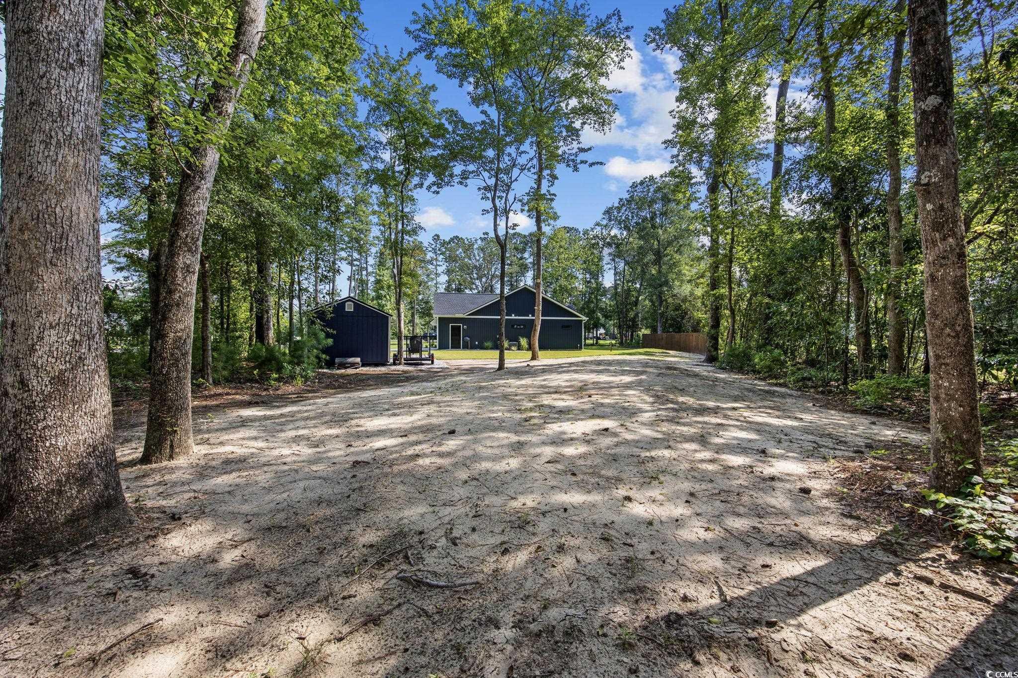 4446 Boggy Road Conway, SC 29526 - Photo 22 of 25 Exterior space featuring dirt driveway and an outbuilding