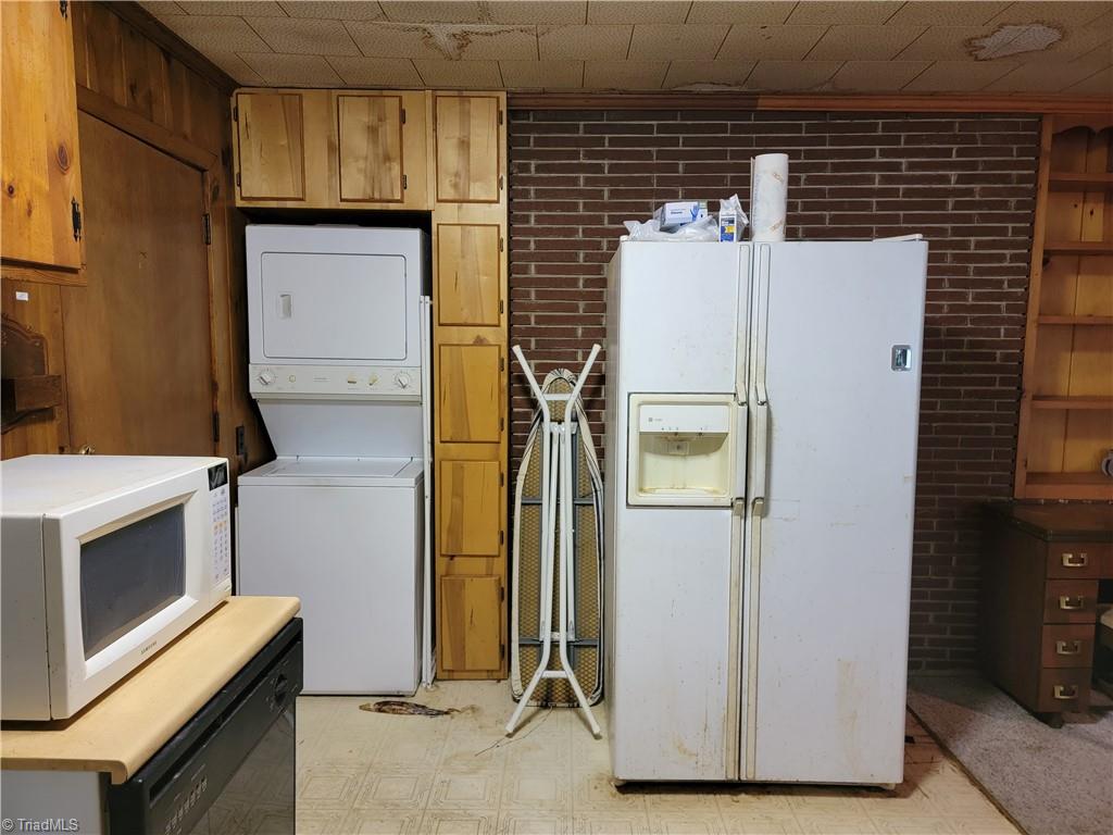 744 Stokesburg Road Walnut Cove, NC 27052 - Photo 14 of 41 Kitchen with Stackable Washer & Dryer area