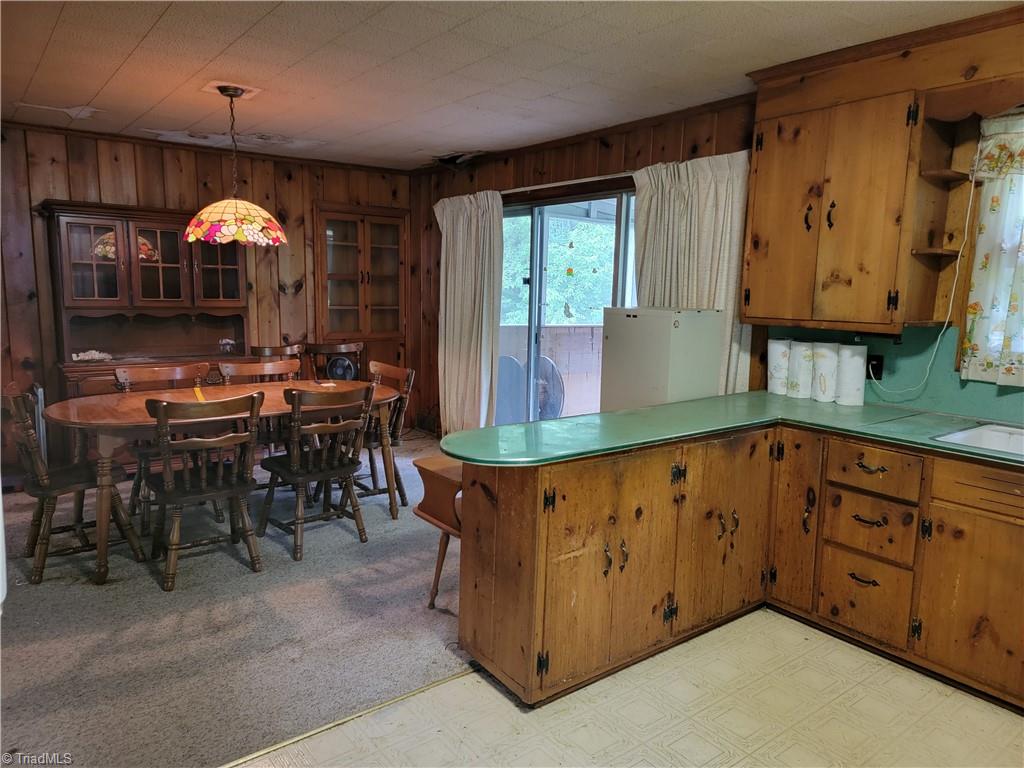 744 Stokesburg Road Walnut Cove, NC 27052 - Photo 15 of 41 View from Kitchen to Dining Room - Dining Room with built-in Cabinet