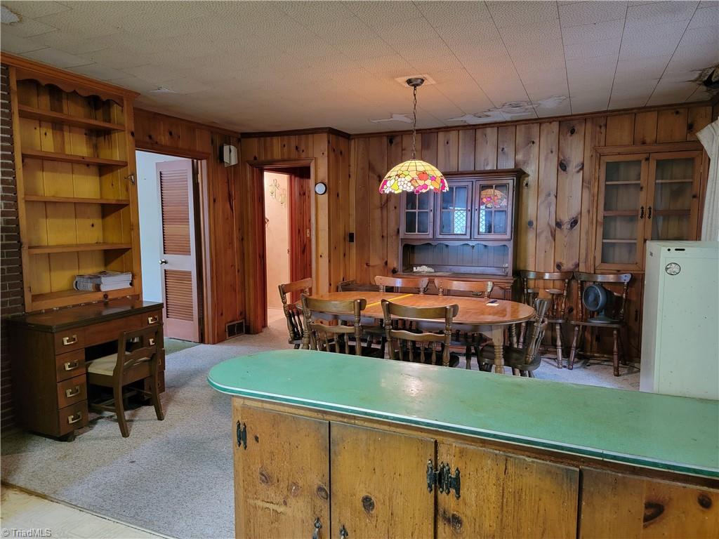 744 Stokesburg Road Walnut Cove, NC 27052 - Photo 16 of 41 Additional View from Kitchen to Dining Room with view of Built-in Shelving