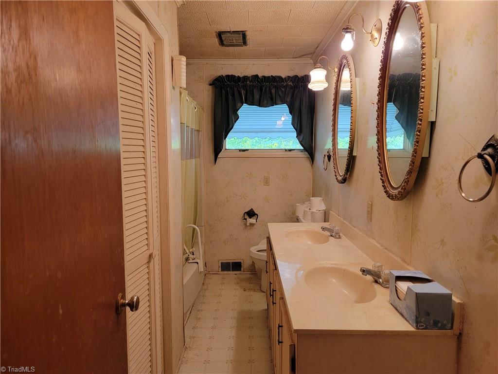 744 Stokesburg Road Walnut Cove, NC 27052 - Photo 20 of 41 Hall Bath with Linen Closet and dual sinks