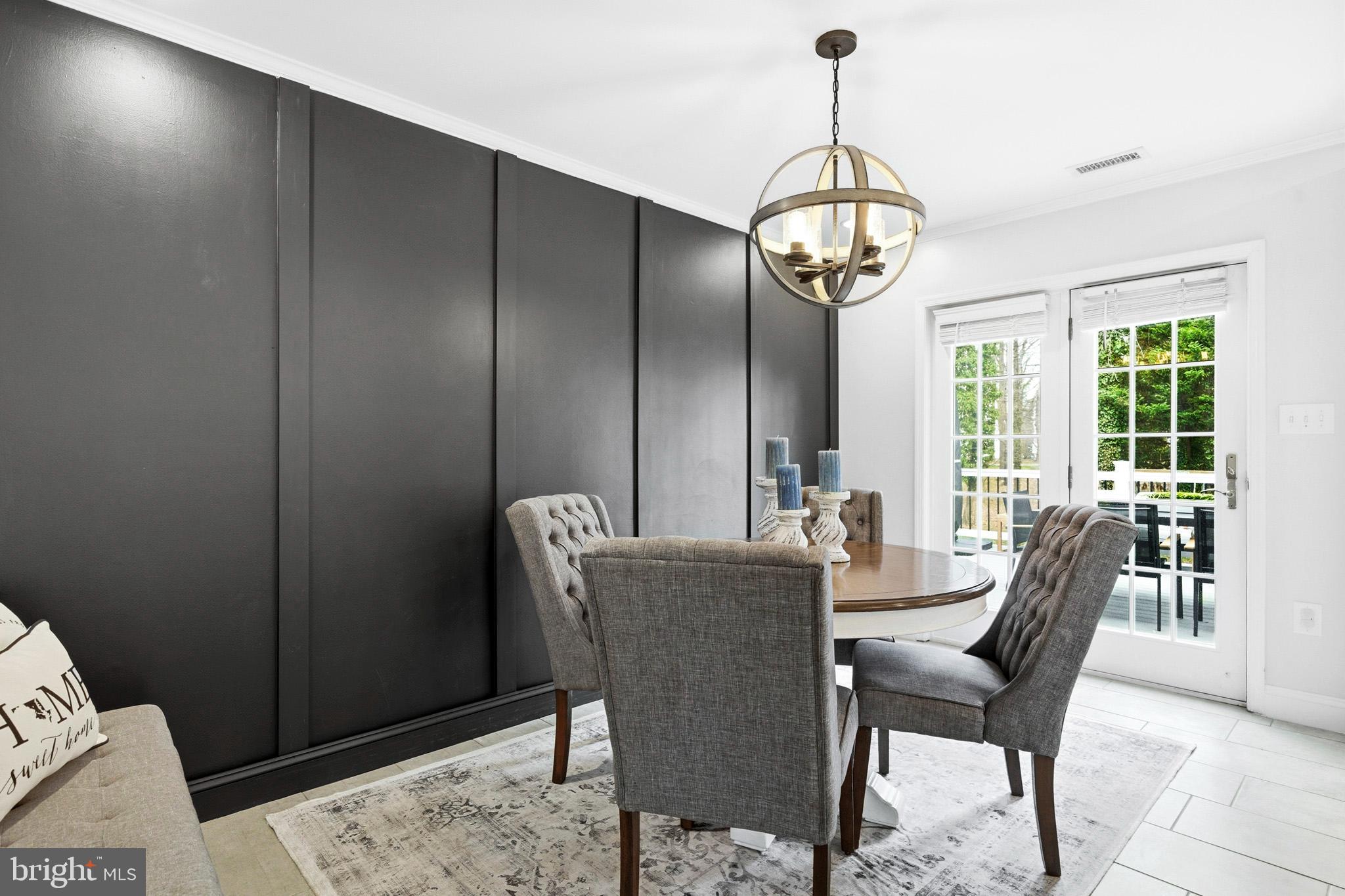 3930 Dogwood Road Port Republic, MD 20676 - Photo 13 of 48 a dining room with furniture a chandelier and wooden floor