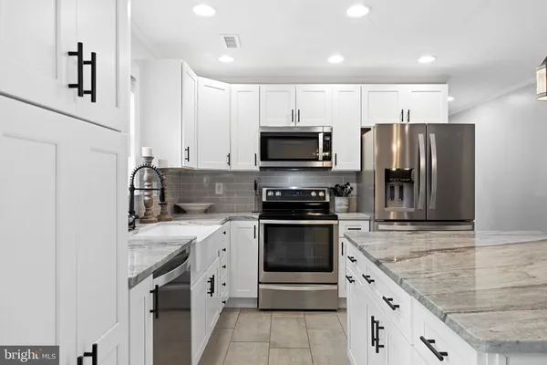 a open kitchen with a table and chairs in it