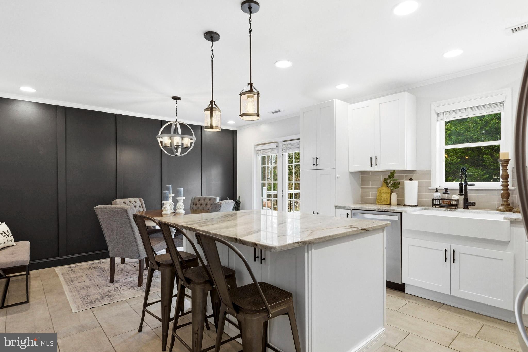 3930 Dogwood Road Port Republic, MD 20676 - Photo 17 of 48 a open kitchen with a table and chairs in it