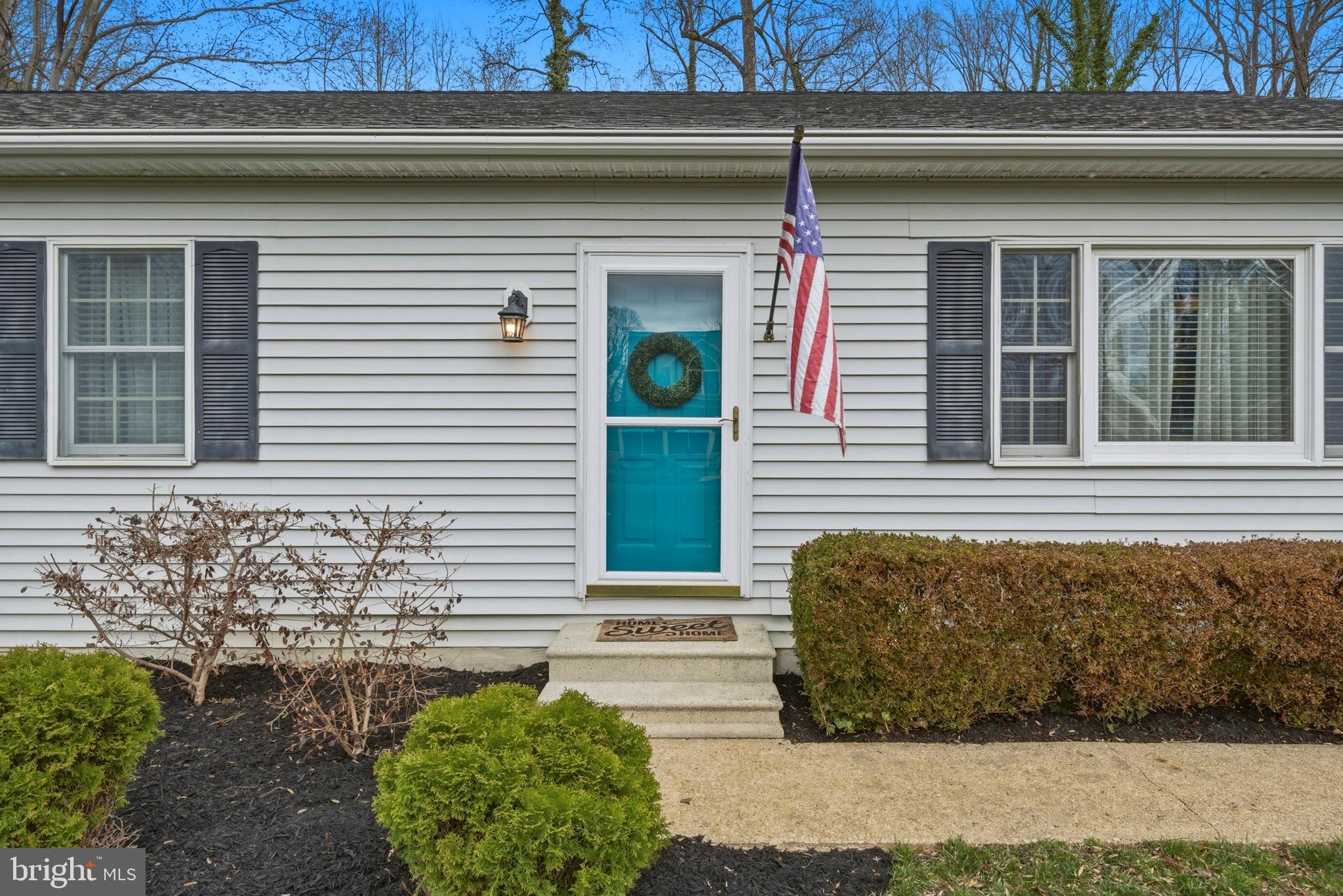 3930 Dogwood Road Port Republic, MD 20676 - Photo 2 of 48 a front view of a house with a garage