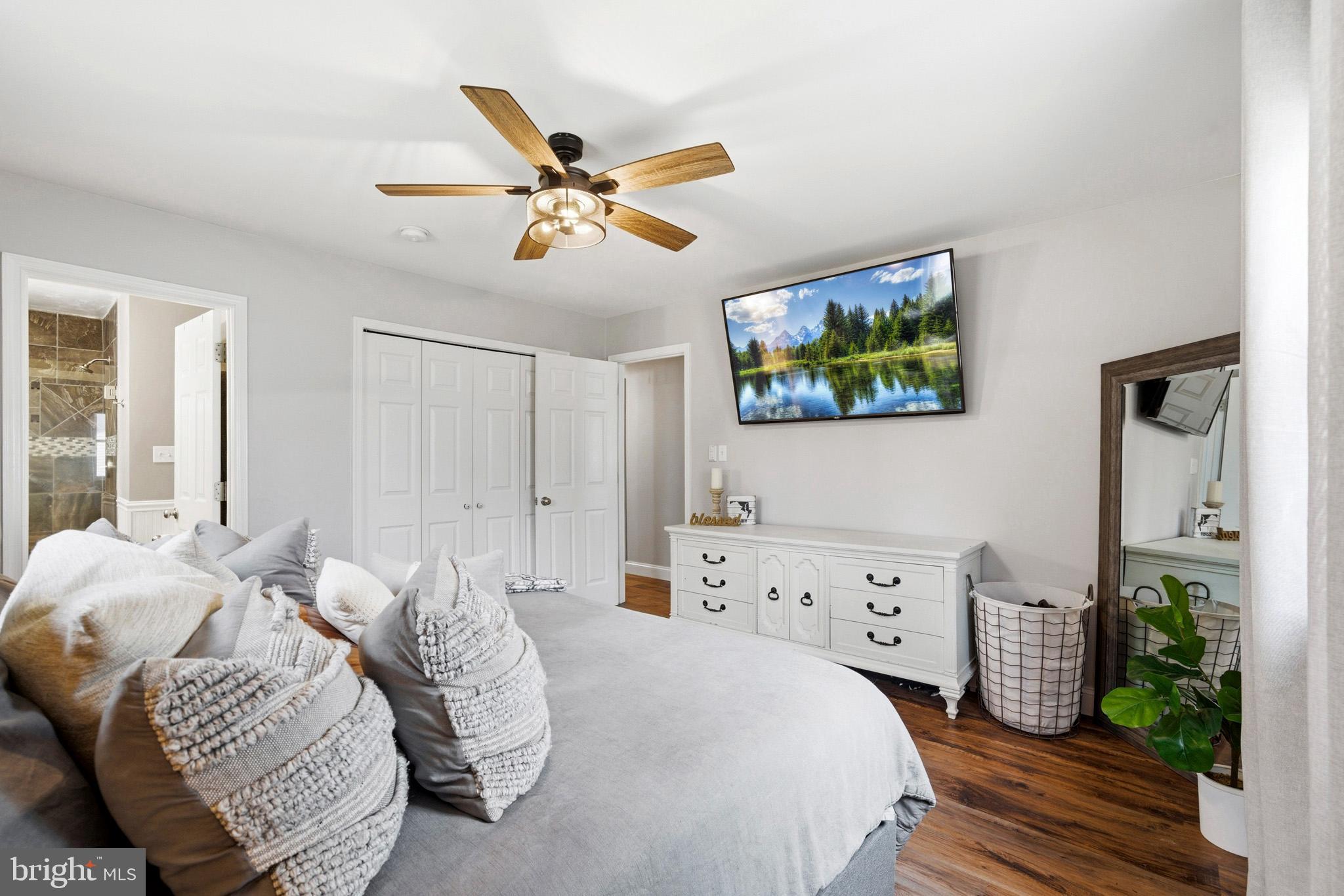 3930 Dogwood Road Port Republic, MD 20676 - Photo 22 of 48 a bedroom with a bed and a chandelier