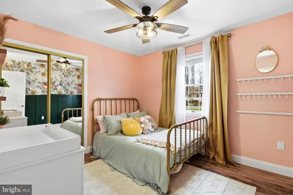 a bedroom with furniture and a window