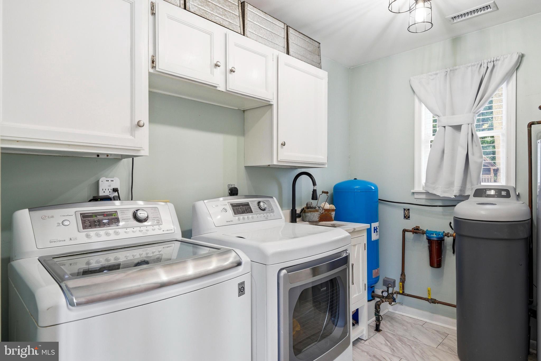 3930 Dogwood Road Port Republic, MD 20676 - Photo 30 of 48 a utility room with dryer and washer